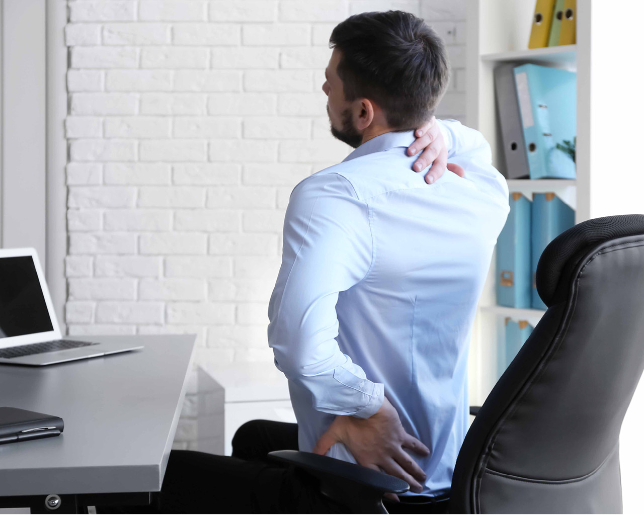 pic of a man sitting at a desk